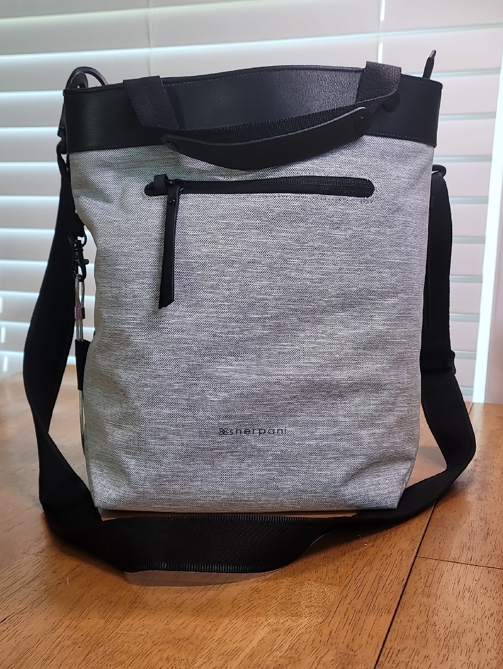 Sherpani Geo AT anti-theft crossbody bag features a durable, lightweight heather